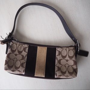 Brown Coach signature bag with suede stripes
